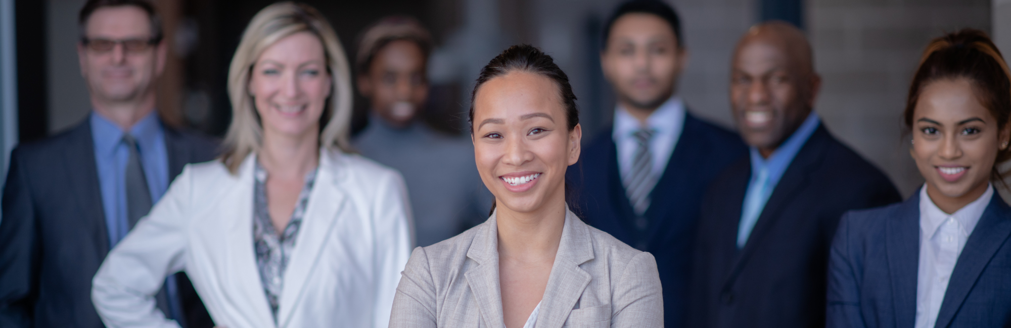 business woman with team behind her