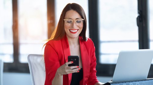 woman in red using technology